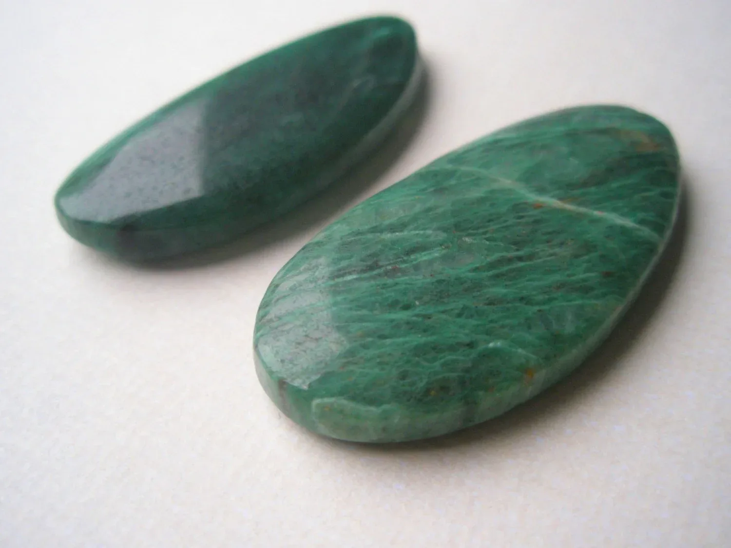 A jade stone, the namesake and color reference for the brand