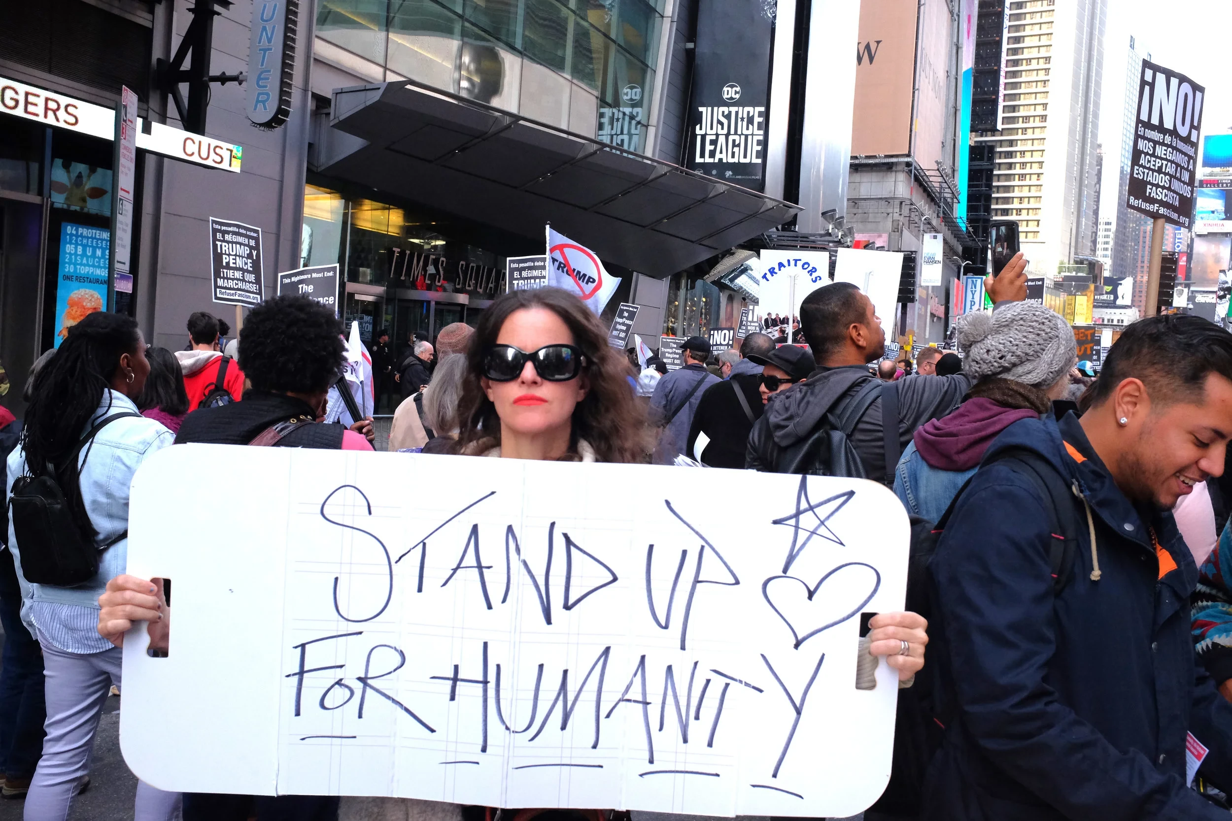 Protesters carrying signs and megaphones at Remove Fascism's rally in Times Square, Nov 4th 2017