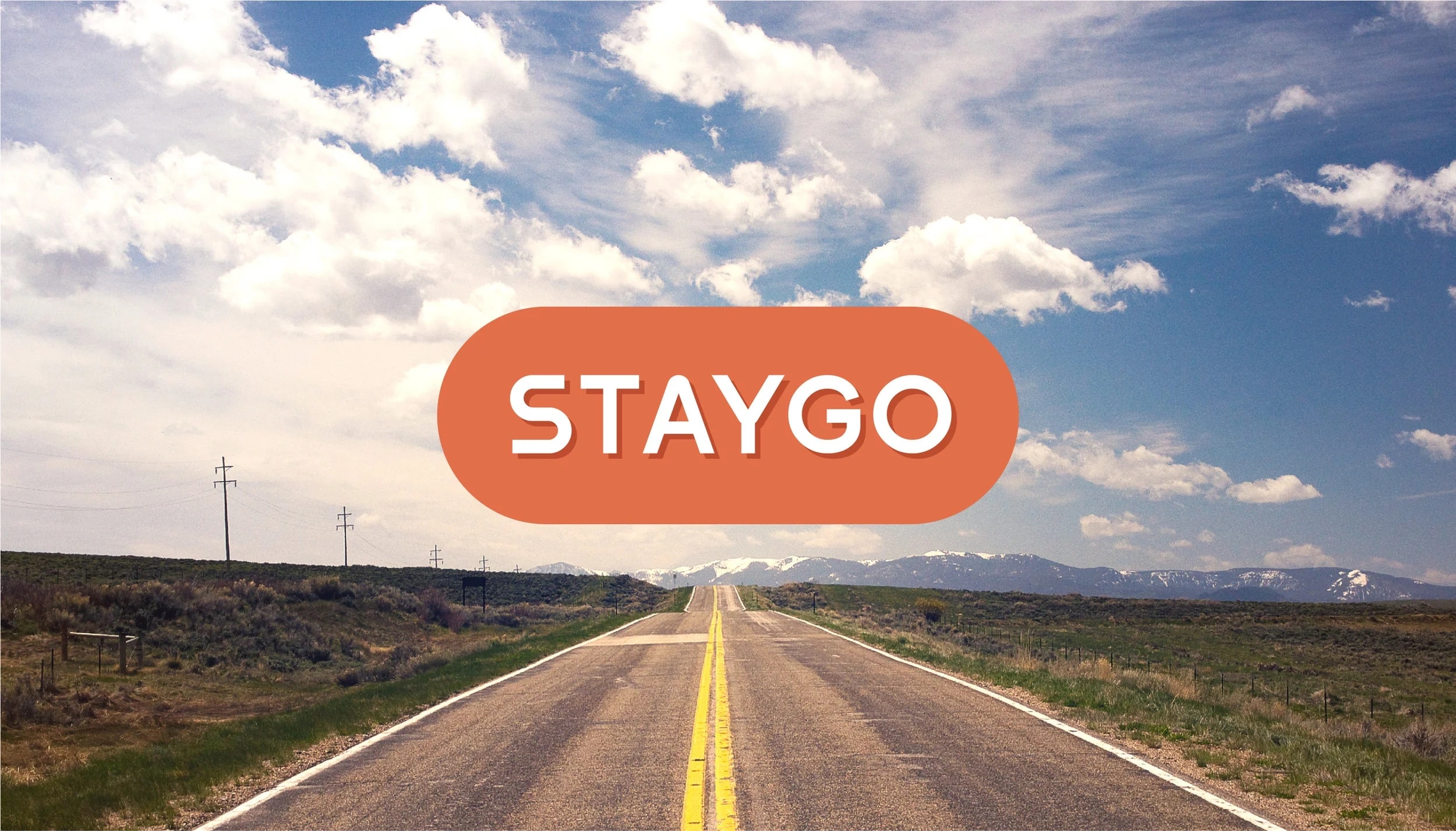 The StayGo wordmark, superimposed over an open highway